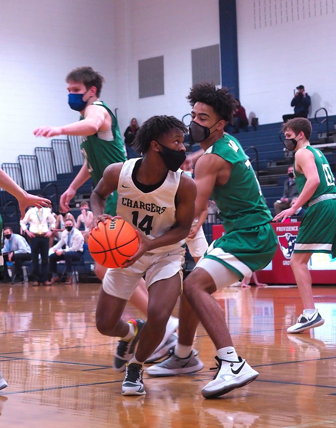 Northwood freshman guard Fred Whitaker (14) pivots just outside of the paint in his team's loss to Weddington, 56-47, on Saturday. Whitaker finished the day with 12 points and 6 assists.